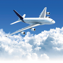 Фотообои с самолетом над белыми облаками