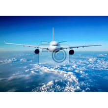 Фотообои с пассажирским самолетом в облаках